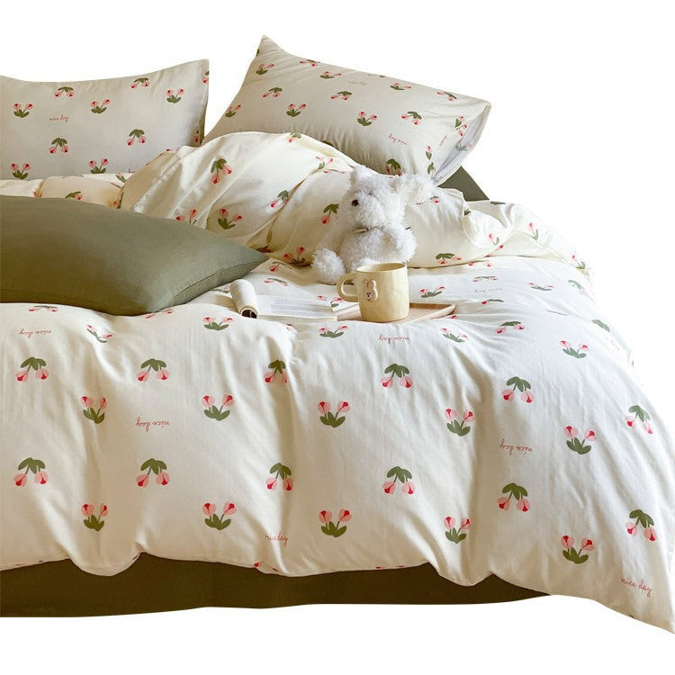 Cotton satin bedding set with playful strawberry all-over print and reversible blanket