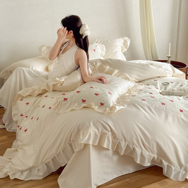 Romantic cotton satin bed linen set with ruffle, decorative panel and delicate animal print Bowlift
