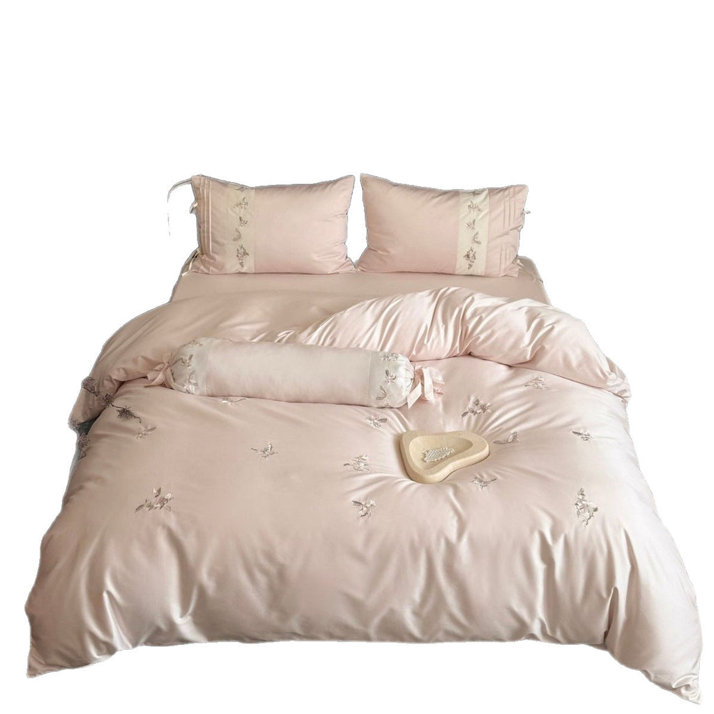 Luxurious satin bedding set with embroidered floral appliqués and bolster Bowlift