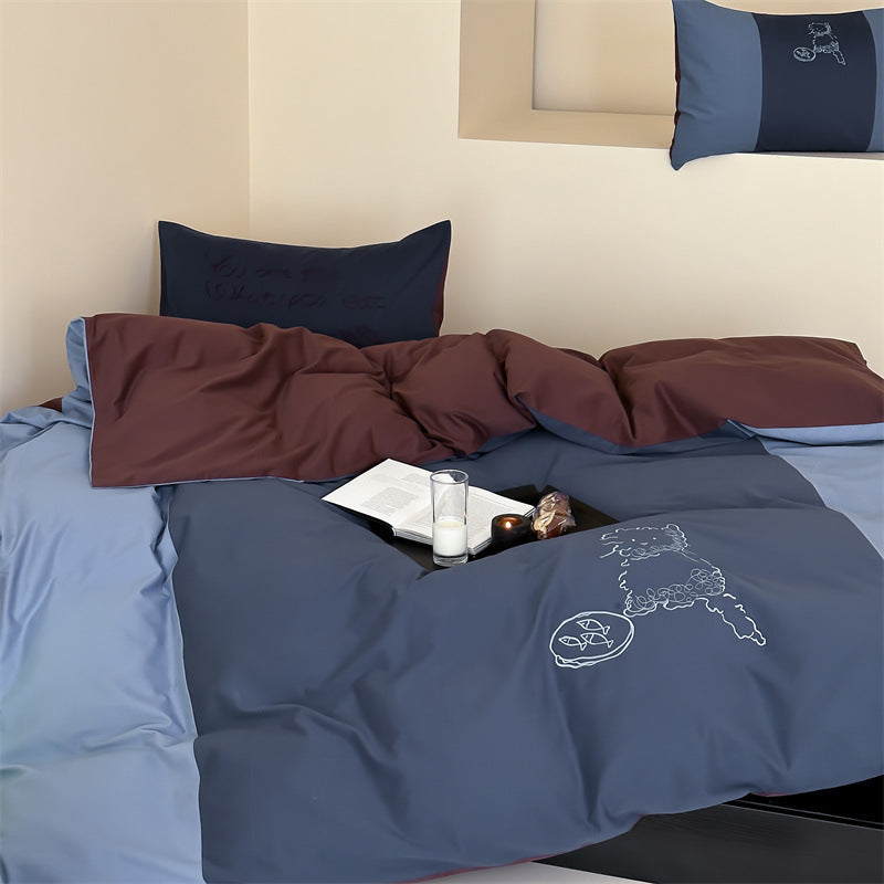 Reversible bedding set with contrasting inserts and fine line embroidery