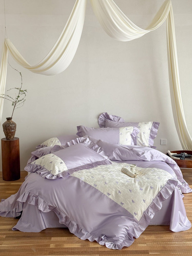 Romantic cotton satin bed linen set with ruffle, decorative panel and delicate animal print Bowlift