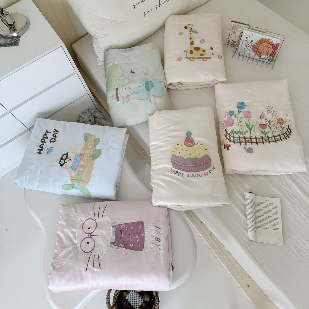 Children's comfort quilt with sweet bunny embroidery and silky satin cover