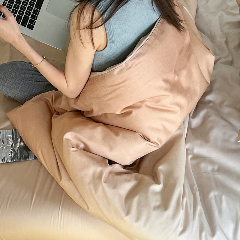 Reversible cotton satin bedding set with a gentle color gradient, wrinkle-free finish, and zipper