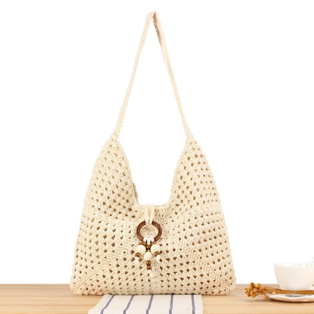 Siopsrl | Handbag made of hand-knotted natural material with chic tassel decoration Siopsrl