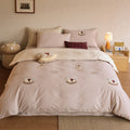 Reversible bedding set with embroidered teddy appliqués