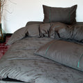 Luxurious satin bedding with floral jacquard and contrast piping
