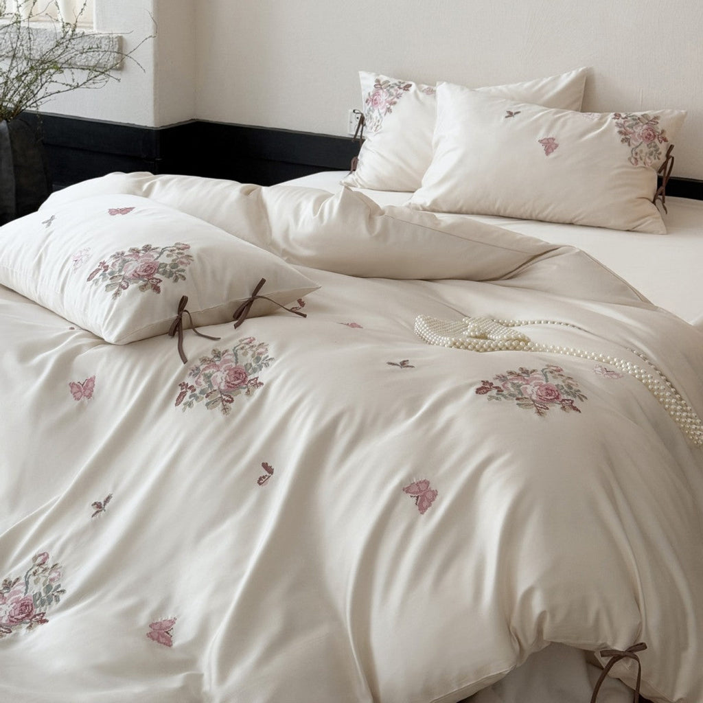 Fine satin bedding set with floral embroidery, tie ribbons and fine quilted texture Bowlift