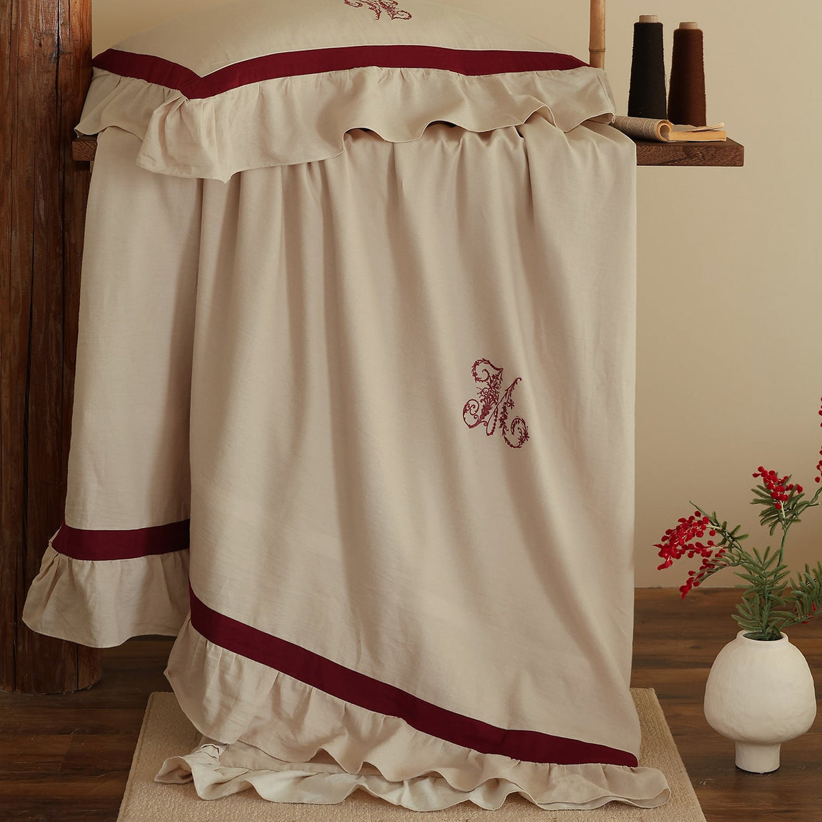 Romantic cotton-linen bedding set with ruffle, monogram embroidery, and contrasting trim Bowlift