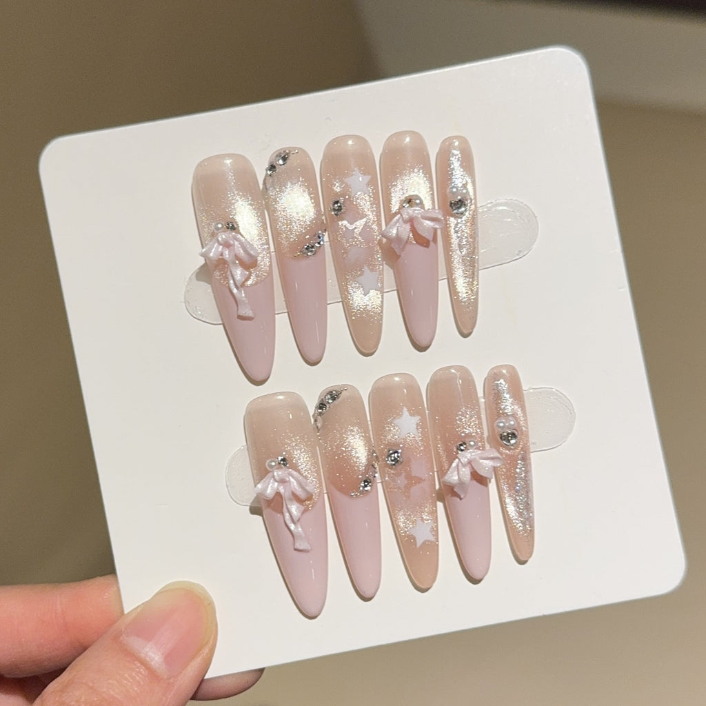 Siopsrl | Artificial nail tips with glamorous glitter and bow details Siopsrl