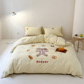 Bedding set made of cotton satin with embroidered baker motif