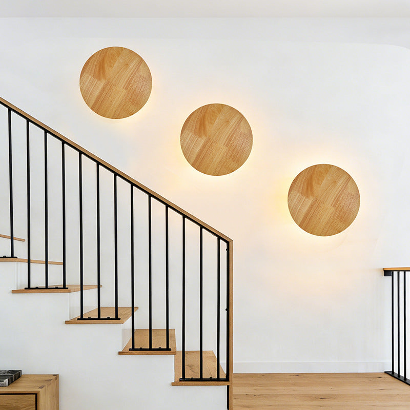 Organic pebble-shaped LED wall sconce solid wood face warm ambient backlight Siopsrl