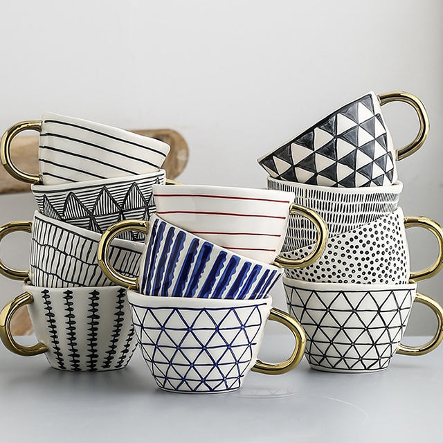 Siopsrl| Cup with abstract geometric pattern and gold handle